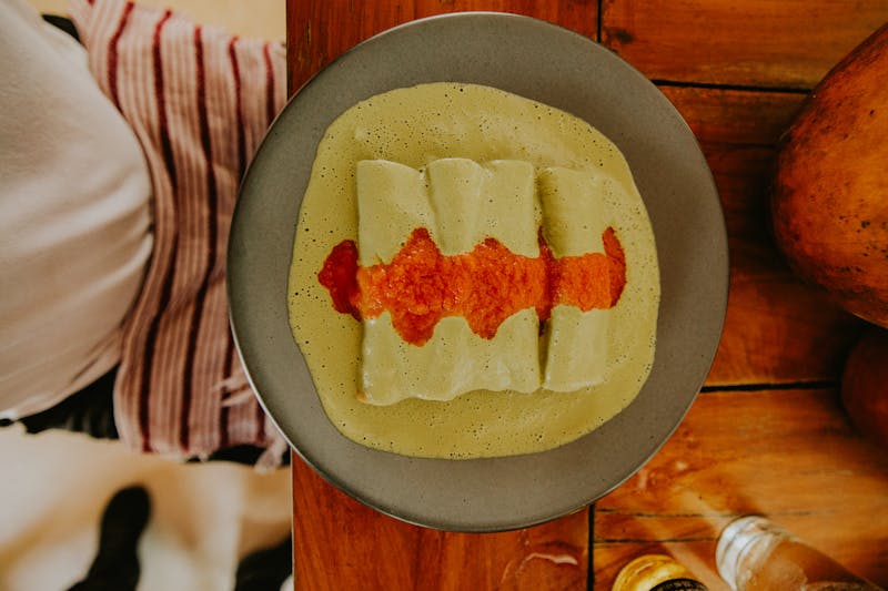 Cafe Rio cheese enchiladas with red sauce and sour cream